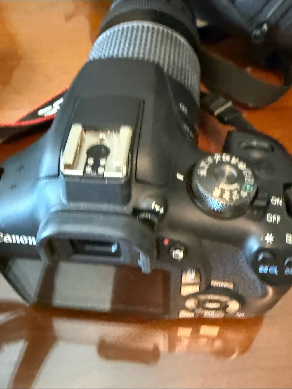 Canon EOS Rebel T5i Black DSLR with Long Black Telephoto Lens